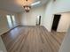 Bright living room featuring vaulted ceilings, skylights, and modern lighting fixtures at 1348 Secretariat Ln, Indianapolis, IN 46217