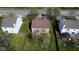 Aerial view of a two-story home with a well-manicured lawn and mature trees in a residential neighborhood at 13660 N Ayrshire Cir, Camby, IN 46113