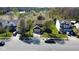 Aerial view of a home with mature trees, well-maintained lawn, and a paved driveway in a suburban neighborhood at 13660 N Ayrshire Cir, Camby, IN 46113