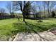 Spacious backyard with well-maintained lawn, mature trees, and swing set, perfect for outdoor activities at 13660 N Ayrshire Cir, Camby, IN 46113