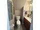 Bathroom features wooden shutters, toilet, and cabinet with sink at 13660 N Ayrshire Cir, Camby, IN 46113