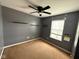 Bedroom with a ceiling fan, window, gray walls, and carpet flooring at 13660 N Ayrshire Cir, Camby, IN 46113