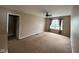 A bedroom featuring a window and ceiling fan at 13660 N Ayrshire Cir, Camby, IN 46113