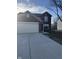 Well-maintained two-story brick home with a two car garage, showcasing its inviting facade at 13660 N Ayrshire Cir, Camby, IN 46113
