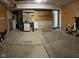 Spacious garage offering ample storage and workspace with clean floors and well-organized storage areas at 13660 N Ayrshire Cir, Camby, IN 46113