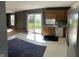 Open-concept kitchen featuring wood cabinets, stainless steel appliances, and a sliding glass door to the backyard at 13660 N Ayrshire Cir, Camby, IN 46113