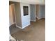 A living room with access to a hallway and stairs at 13660 N Ayrshire Cir, Camby, IN 46113