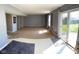 A bright living room with sliding glass doors leading to the backyard at 13660 N Ayrshire Cir, Camby, IN 46113