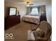 A well lit main bedroom with a large bed and furniture at 13660 N Ayrshire Cir, Camby, IN 46113