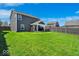 Fenced backyard with a covered patio area, perfect for outdoor entertaining at 159 Longleaf Ln, Greenfield, IN 46140