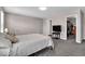 Large main bedroom with plush carpets, neutral tones, and adjoining walk-in closet provides ample space at 159 Longleaf Ln, Greenfield, IN 46140