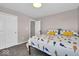 Cozy bedroom featuring carpeted floors, double door closet, and comfortable bed with a colorful comforter at 159 Longleaf Ln, Greenfield, IN 46140