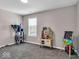 Bedroom featuring carpeted floors, bright natural light, and neutral walls at 159 Longleaf Ln, Greenfield, IN 46140