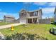 Two-story home featuring gray siding, red shutters, two-car garage, and well-kept lawn at 159 Longleaf Ln, Greenfield, IN 46140
