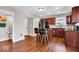 Kitchen featuring stainless steel appliances, center island, and dark wood cabinetry at 159 Longleaf Ln, Greenfield, IN 46140