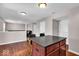 Kitchen with a large island and an open transition into the living room and hallway at 159 Longleaf Ln, Greenfield, IN 46140
