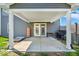 Back patio area has cover, table, and grill at 159 Longleaf Ln, Greenfield, IN 46140
