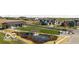 Aerial view of common area with pond, gazebo, and community building surrounded by lush landscaping and homes at 17354 Ditch Rd, Westfield, IN 46074