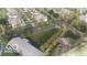 An aerial view of a green space within the neighborhood surrounded by homes and streets at 17354 Ditch Rd, Westfield, IN 46074