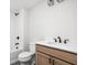 Bathroom featuring a single vanity, tub-shower combo, and modern fixtures at 17354 Ditch Rd, Westfield, IN 46074