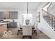 Bright open-concept dining area with white walls and view of the staircase at 17354 Ditch Rd, Westfield, IN 46074