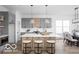 Modern kitchen with an island, a breakfast bar and stylish gray cabinets at 17354 Ditch Rd, Westfield, IN 46074