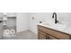 Functional laundry room featuring a sink, storage and modern faucet at 17354 Ditch Rd, Westfield, IN 46074