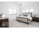 Bright bedroom with a vaulted ceiling, large windows, and modern furnishings at 17354 Ditch Rd, Westfield, IN 46074