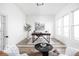 Bright office area with a patterned rug, a desk, plants, and natural light at 17354 Ditch Rd, Westfield, IN 46074