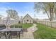 Spacious backyard featuring a dining table, an outdoor structure, and a stone walkway at 1741 Caldwell Pl, Columbus, IN 47201