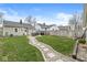 Large backyard with a stone path, grassy areas, and fencing, ideal for outdoor enjoyment at 1741 Caldwell Pl, Columbus, IN 47201