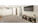 Finished basement features neutral decor, plush carpeting and access to the unfinished portion of the basement at 1741 Caldwell Pl, Columbus, IN 47201