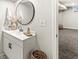 Basement bathroom features mosaic flooring, decorative mirror, and a white vanity at 1741 Caldwell Pl, Columbus, IN 47201
