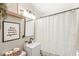 Charming bathroom features a vanity, framed print, and shower with curtain at 1741 Caldwell Pl, Columbus, IN 47201