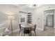 Charming dining area with a round table, modern light fixture, and a view to the kitchen at 1741 Caldwell Pl, Columbus, IN 47201