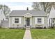 Charming one-story home with a well-manicured lawn, and a welcoming front door and entryway at 1741 Caldwell Pl, Columbus, IN 47201