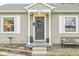 Inviting front porch with a decorative wreath on the front door and a comfortable bench at 1741 Caldwell Pl, Columbus, IN 47201