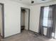 This bedroom features new carpet, neutral walls, a ceiling fan and a built-in closet for storage solutions at 1804 W 15Th St, Muncie, IN 47302
