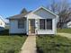 Charming single-story home features a well-maintained front yard and classic architectural details at 1804 W 15Th St, Muncie, IN 47302