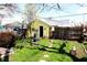 Landscaped backyard features a storage shed, stepping stones, and room to roam at 2025 Barth Ave, Indianapolis, IN 46203