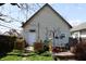 Nice backyard features a deck, a storage shed, a bird feeder, and a grill at 2025 Barth Ave, Indianapolis, IN 46203