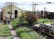 Spacious backyard features a storage shed and greenery for outdoor activities at 2025 Barth Ave, Indianapolis, IN 46203