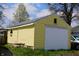 Yellow one-car garage offers parking and storage space for vehicles and equipment at 2025 Barth Ave, Indianapolis, IN 46203