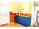 Charming kitchen features a blue kitchen island with butcher block top and lots of natural light at 2025 Barth Ave, Indianapolis, IN 46203
