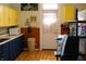 Kitchen featuring updated countertops, appliances, and colorful cabinets at 2025 Barth Ave, Indianapolis, IN 46203