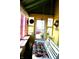 Inviting sunroom offering a serene space with colorful cushions at 2025 Barth Ave, Indianapolis, IN 46203