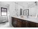 Well-lit bathroom with a double vanity featuring marble countertops and modern pendant lighting at 2134 N New Jersey St, Indianapolis, IN 46202