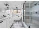Elegant bathroom featuring a soaking tub, walk-in shower, double vanity, and stylish herringbone tile flooring at 2134 N New Jersey St, Indianapolis, IN 46202