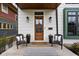 Inviting front porch with seating area and decorative plants at 2134 N New Jersey St, Indianapolis, IN 46202