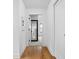 Bright hallway with hardwood floors and views into other rooms of the home at 2134 N New Jersey St, Indianapolis, IN 46202
